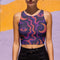 Cropped tank top with psychedelic purple and coral swirling waves pattern featuring mystical third eye designs, racerback style sleeveless womens festival top with body-hugging fit for rave outfits, alternative clothing, y2k aesthetic streetwear, trippy spiritual print crop top for concerts and music festivals, black owned shops bohemian mystical shirt